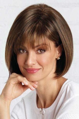 Woman in short, straight bob wig with bangs